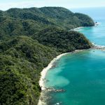 Ballena Bay Coast - Source: Freed, Tami. Lush Jungle Covered Mountains Stretch Out into the Gulf of Nicoya Next to the Rocky and Sandy Beach of Ballena Bay in Costa Rica. Digital Image. Shutterstock, [Date Published Unknown]